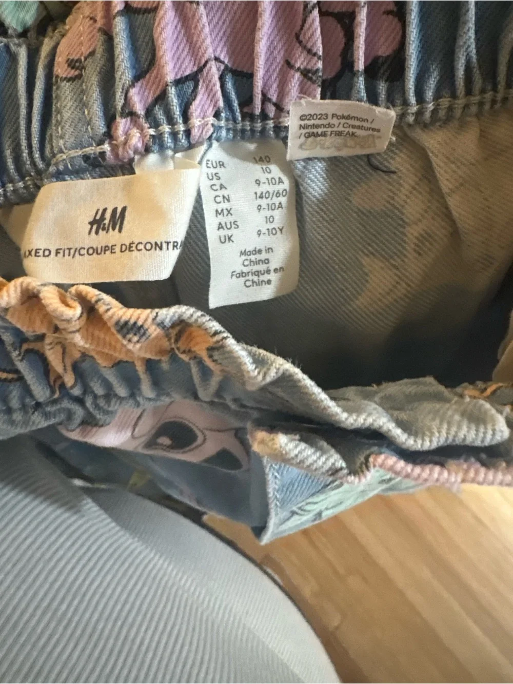 H&M Pokémon Print light denim relaxed fit paper bag Jean. Size 10